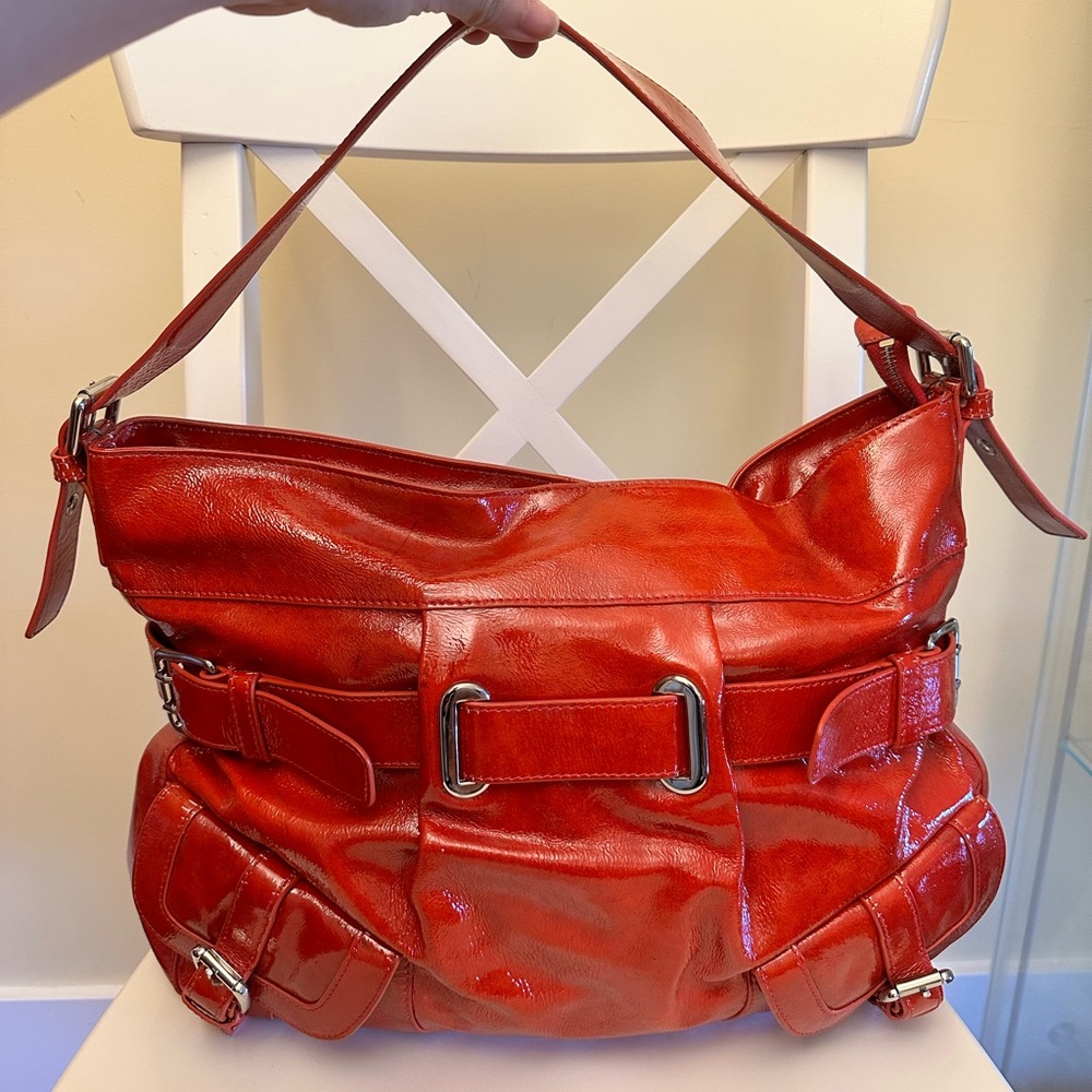 Millie’s red patent leather bag